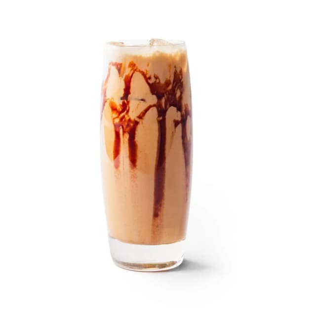 An Arwa palm date latte in a branded cup